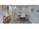 A cozy home office featuring light blue walls, a modern desk setup, and decorative artwork for a productive workspace at 703 E Horne St, Clayton, NC 27520