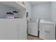 Functional laundry room with washer, dryer, storage shelves and ample space at 703 E Horne St, Clayton, NC 27520