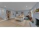 A beautifully decorated main bedroom featuring light blue walls and a comfortable bed with decorative furnishings at 703 E Horne St, Clayton, NC 27520