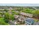 Aerial view of homes in a community surrounded by lush green trees at 714 Mordecai Towne Pl, Raleigh, NC 27604