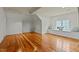 Bright bonus room with hardwood floors, window bench seating, and a sloped ceiling for relaxed living at 714 Mordecai Towne Pl, Raleigh, NC 27604