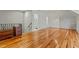 The bonus room has hardwood floors, white trim, and a bathroom in the background, providing versatile living space at 714 Mordecai Towne Pl, Raleigh, NC 27604