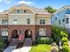 Beautiful brick and siding home with inviting arched entryways and well-maintained landscaping and American Flag at 714 Mordecai Towne Pl, Raleigh, NC 27604