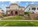 Charming exterior elevation with brick facade, arched entryway, green lawn, and inviting curb appeal at 714 Mordecai Towne Pl, Raleigh, NC 27604