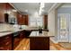 Well-equipped kitchen featuring stainless steel appliances, wooden cabinetry, and granite countertops at 714 Mordecai Towne Pl, Raleigh, NC 27604