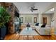 Inviting living room with hardwood floors, ceiling fan, stylish decor, and a cozy atmosphere at 714 Mordecai Towne Pl, Raleigh, NC 27604