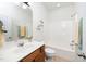 Bright bathroom with tub, shower, and wood vanity at 746 Wickham Ridge Rd, Apex, NC 27539