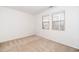 Sunlit bedroom with neutral carpet and two large windows at 746 Wickham Ridge Rd, Apex, NC 27539