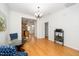 Elegant dining room with a glass table, stylish chairs, and hardwood floors at 746 Wickham Ridge Rd, Apex, NC 27539
