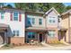 Charming townhome boasts brick accents and stylish architectural details at 746 Wickham Ridge Rd, Apex, NC 27539
