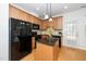 Modern kitchen boasts granite counters, a central island, and stainless appliances at 746 Wickham Ridge Rd, Apex, NC 27539