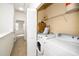 Convenient laundry area with a washer, dryer, and wire shelving at 746 Wickham Ridge Rd, Apex, NC 27539