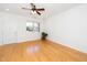 Bright living room with hardwood floors, natural light, and a ceiling fan at 746 Wickham Ridge Rd, Apex, NC 27539