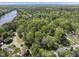 Picturesque aerial view showcases the home's location nestled among mature trees in a serene, desirable neighborhood at 7705 Glenharden Dr, Raleigh, NC 27613