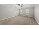 Neutral bedroom features plush carpeting and natural light from windows at 7705 Glenharden Dr, Raleigh, NC 27613