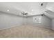 Spacious bonus room with plush carpet, neutral paint, ceiling fan and bright natural light at 7705 Glenharden Dr, Raleigh, NC 27613