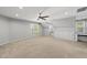 Large bonus room with carpet, built-in storage and desk area, and bright natural light at 7705 Glenharden Dr, Raleigh, NC 27613