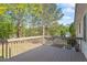 Exterior deck featuring wood-stained railings and a view of mature trees at 807 Clean View Ct, Fuquay Varina, NC 27526