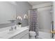 Clean bathroom featuring a shower and tub combo, white sink, white vanity, and gray walls at 807 Clean View Ct, Fuquay Varina, NC 27526