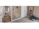 Bedroom with exercise equipment and view to a hallway and bed at 807 Clean View Ct, Fuquay Varina, NC 27526