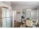 An open concept dining area connects seamlessly with stainless steel kitchen appliances, great for entertaining at 807 Clean View Ct, Fuquay Varina, NC 27526