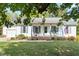 Inviting home with a cozy front porch, featuring classic details and a well-maintained lawn at 807 Clean View Ct, Fuquay Varina, NC 27526