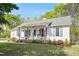 Charming one-story home with a welcoming front porch and an American flag, perfect for suburban living at 807 Clean View Ct, Fuquay Varina, NC 27526