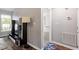 Hallway with a media center, lamp, and view into another room at 807 Clean View Ct, Fuquay Varina, NC 27526