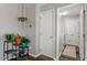Hallway featuring neutral walls with access to a laundry room and home decor at 807 Clean View Ct, Fuquay Varina, NC 27526