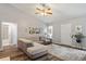 Comfortable living room with a neutral palette, plush rug, and ample natural light, ideal for relaxation at 807 Clean View Ct, Fuquay Varina, NC 27526