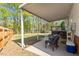 Covered patio with seating offers a relaxing outdoor space overlooking the lawn and mature trees at 807 Clean View Ct, Fuquay Varina, NC 27526