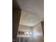 This bathroom has dated ceiling, walls, fixtures and damage; property sold AS IS at 811 New Kent Pl # 1A, Cary, NC 27511