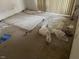 This bedroom has debris, dated carpet, and damage; property sold AS IS at 811 New Kent Pl # 1A, Cary, NC 27511