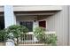 Condo entrance featuring a red door, partial porch, and visible unit number for easy identification at 811 New Kent Pl # 1A, Cary, NC 27511