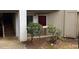 Exterior of condo with ground floor entrance, stairs to upper units, and sparse landscaping at 811 New Kent Pl # 1A, Cary, NC 27511