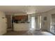 Spacious condo living room leading into the kitchen and featuring sliding glass doors at 811 New Kent Pl # 1A, Cary, NC 27511