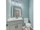 Powder room offers vanity with storage and contemporary fixtures, plus a comfort height toilet at 858 Lake Artesia Ln, Fuquay Varina, NC 27526