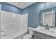 Clean bathroom features a shower-tub combo and a vanity with cabinet space for storage at 858 Lake Artesia Ln, Fuquay Varina, NC 27526