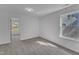 A bedroom features neutral carpet and one window at 858 Lake Artesia Ln, Fuquay Varina, NC 27526