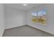 Well-lit bedroom with a window offering a view of the surrounding neighborhood at 858 Lake Artesia Ln, Fuquay Varina, NC 27526