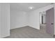Spacious bedroom with neutral carpet and a doorway leading to another room at 858 Lake Artesia Ln, Fuquay Varina, NC 27526