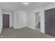 Bedroom with neutral carpet and doors leading to bathroom and other room at 858 Lake Artesia Ln, Fuquay Varina, NC 27526