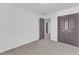 Neutral bedroom with carpet and multiple doors that offer access to other areas at 858 Lake Artesia Ln, Fuquay Varina, NC 27526