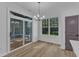 Bright dining area with sliding glass doors to the outside, and vinyl floors at 858 Lake Artesia Ln, Fuquay Varina, NC 27526