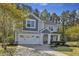 Beautiful two-story home with a two-car garage, manicured lawn and a cozy front porch at 858 Lake Artesia Ln, Fuquay Varina, NC 27526