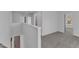 Hallway with a view of the stairs and a bedroom with a neighborhood view at 858 Lake Artesia Ln, Fuquay Varina, NC 27526