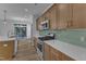 The kitchen features wooden cabinets, stainless steel appliances, and modern countertops, providing a sleek and functional space at 858 Lake Artesia Ln, Fuquay Varina, NC 27526