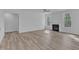 Bright living room featuring a fireplace, new floors, and large windows offering wooded views at 858 Lake Artesia Ln, Fuquay Varina, NC 27526