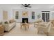 Bright living room features a fireplace, neutral tones, and natural light at 858 Lake Artesia Ln, Fuquay Varina, NC 27526