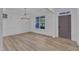 Empty living room with neutral paint, new flooring, and a window at 858 Lake Artesia Ln, Fuquay Varina, NC 27526